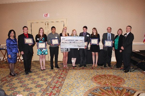 High school scholarship winners and chapter members in May are (l-r) Col. Joyce Jenkins-Harden, USAF (Ret.), chapter executive vice president; Steve Gulliksen; Mikaela Henness-Wilson; Nestor Hernandez; Angela Moser; Clark Mourning; Amy Resman; David Volz (father of recipient Sara Volz); guest speaker Dr. Carol Bach; and Col. Rodney Pohlmann, USAF (Ret.), chapter vice president for education.